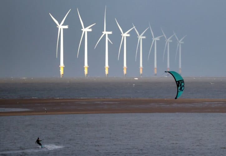 FILE PHOTO: A kite surfer is pictured in front of the Burbo Bank offshore wind farm near New Brighton