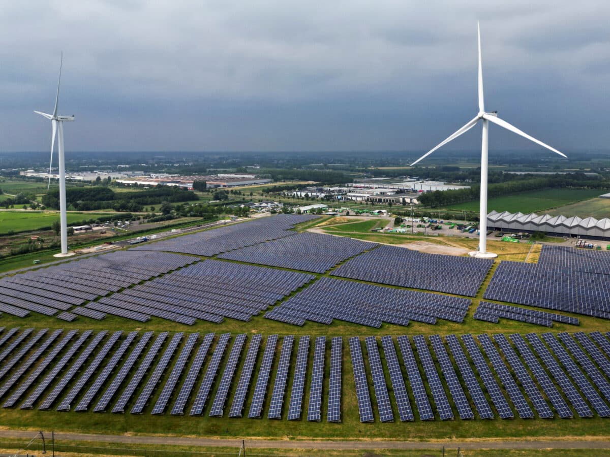 A solar panel park and wind turbines are seen in Geldermalsen